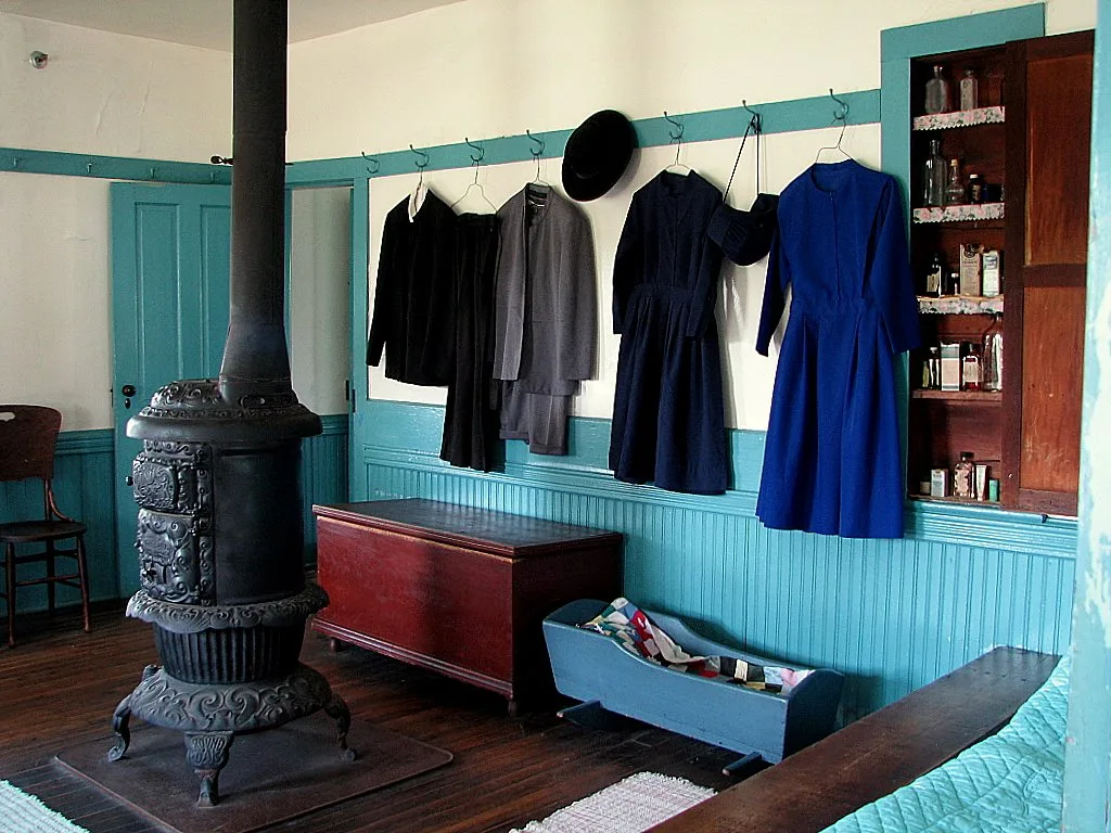 Clothing is plain in style and sewn by hand.