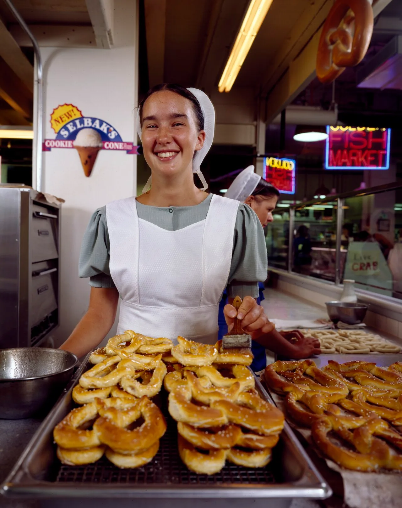 Amish woman from Lancaster County serving pretzels