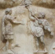 A close-up view of the breastplate on the statue, showing a Parthian man returning to Augustus the legionary standards l