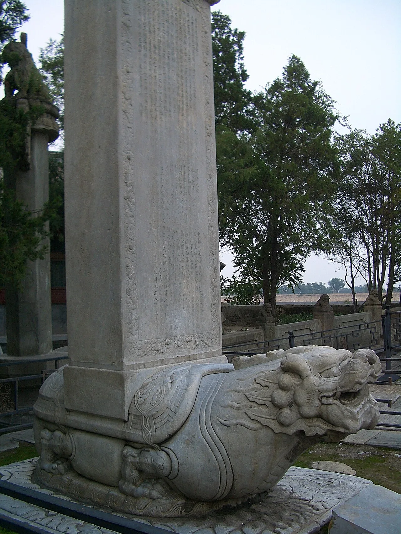A dragon-headed bixi with a stele in memory of the Qianlong Emperor's rebuilding of the Marco Polo Bridge, Beijing, c. 1