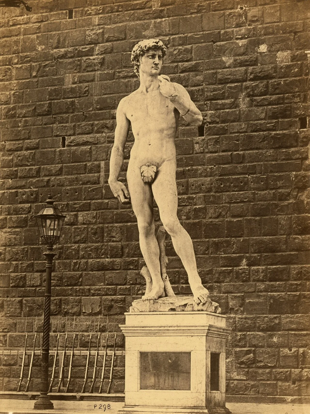 The David in front of the Palazzo Vecchio before 1873, with a leaf covering his genitals