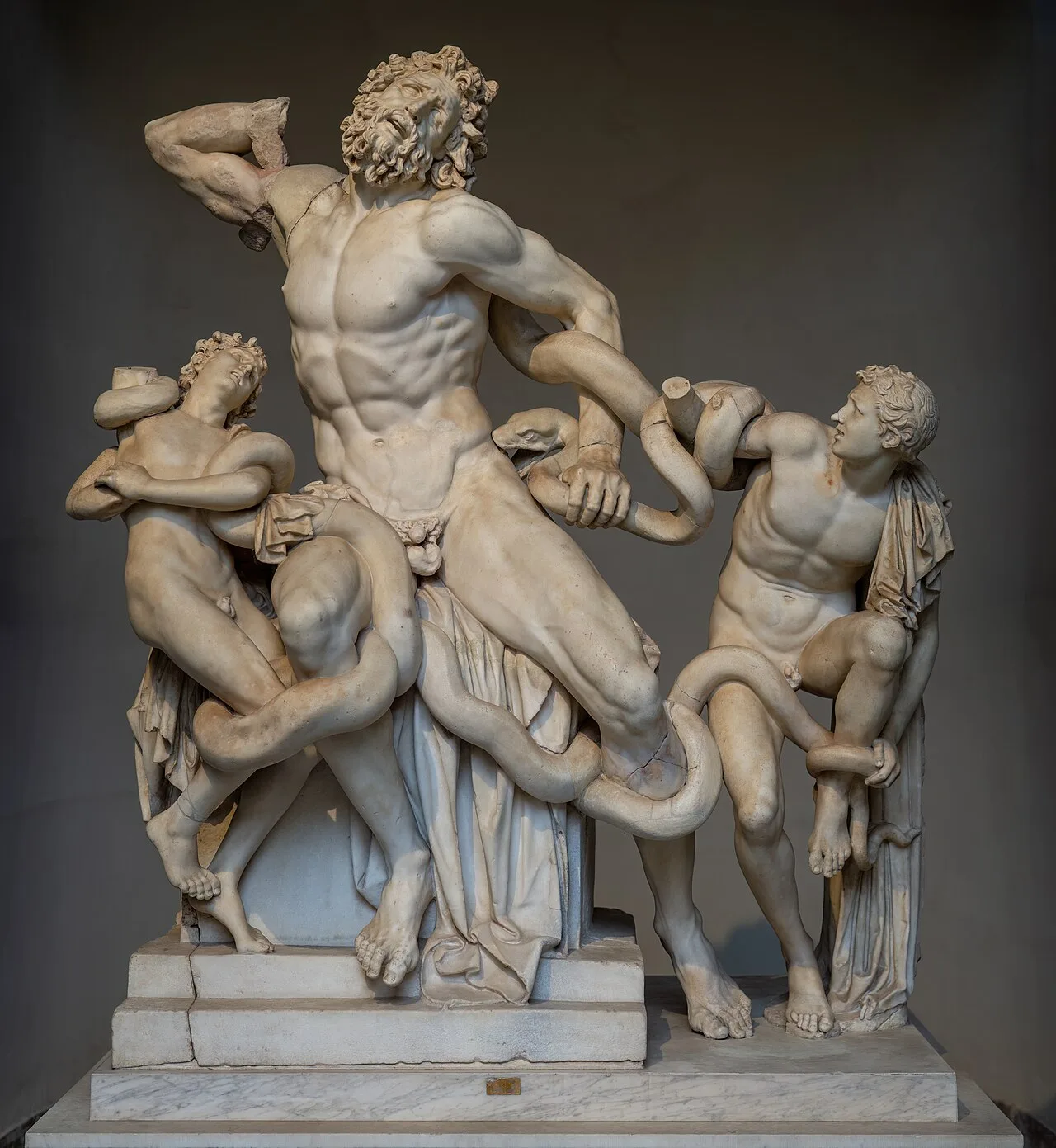 The nude figures in the tondo background are said to have been influenced by the statue of Laocoön and His Sons, found i