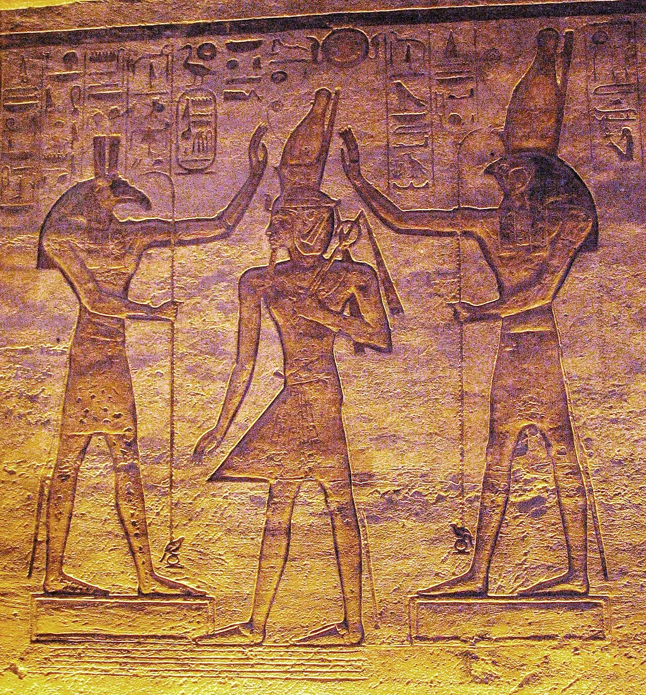 Set and Horus support the pharaoh. The reconciled rival gods often stand for the unity of Egypt under the rule of its ki