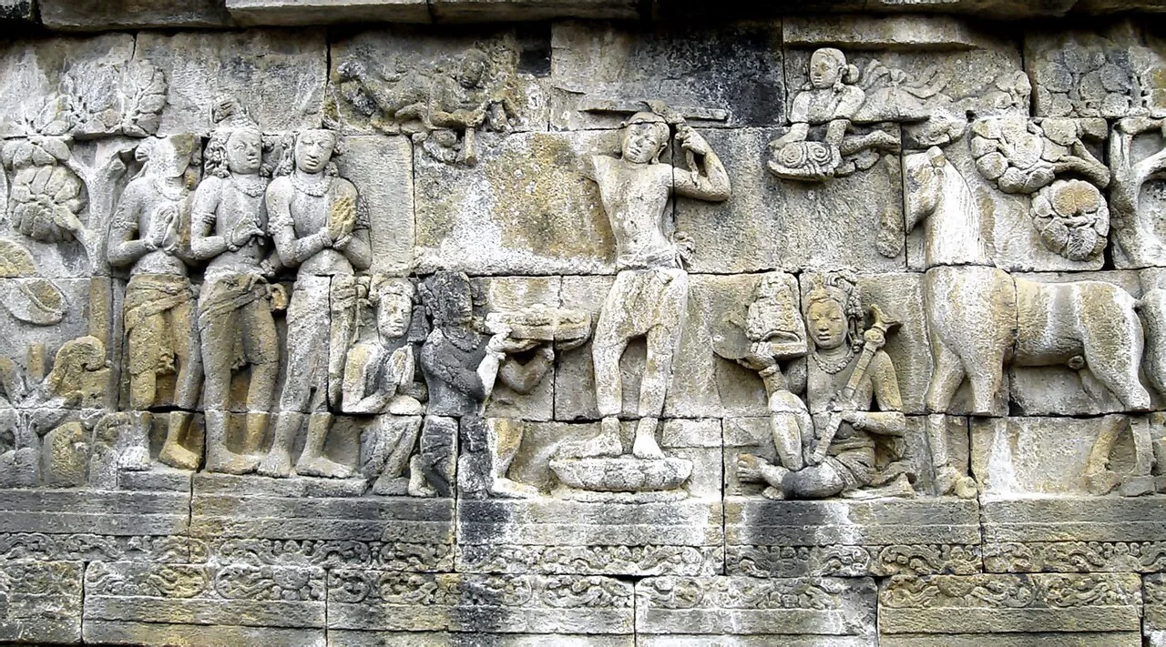 Prince Siddhartha shaves his hair and becomes a śramaṇa. Borobudur, 8th century
