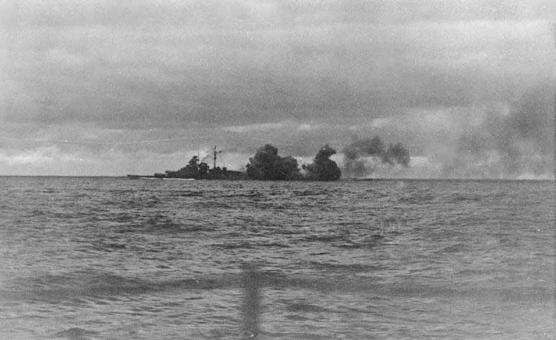 Bismarck firing her main battery during the battle
