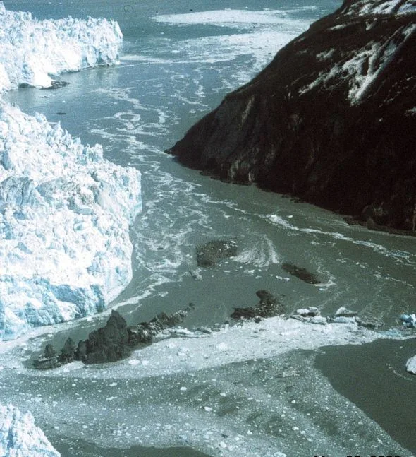 Hubbard Glacier, Alaska, squeezes towards Gilbert Point on May 20, 2002. The glacier is close to sealing off Russell Fjo