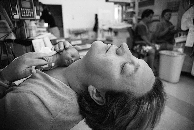 A new mother holds her premature baby at Kapiolani Medical Center NICU in Honolulu, Hawaii