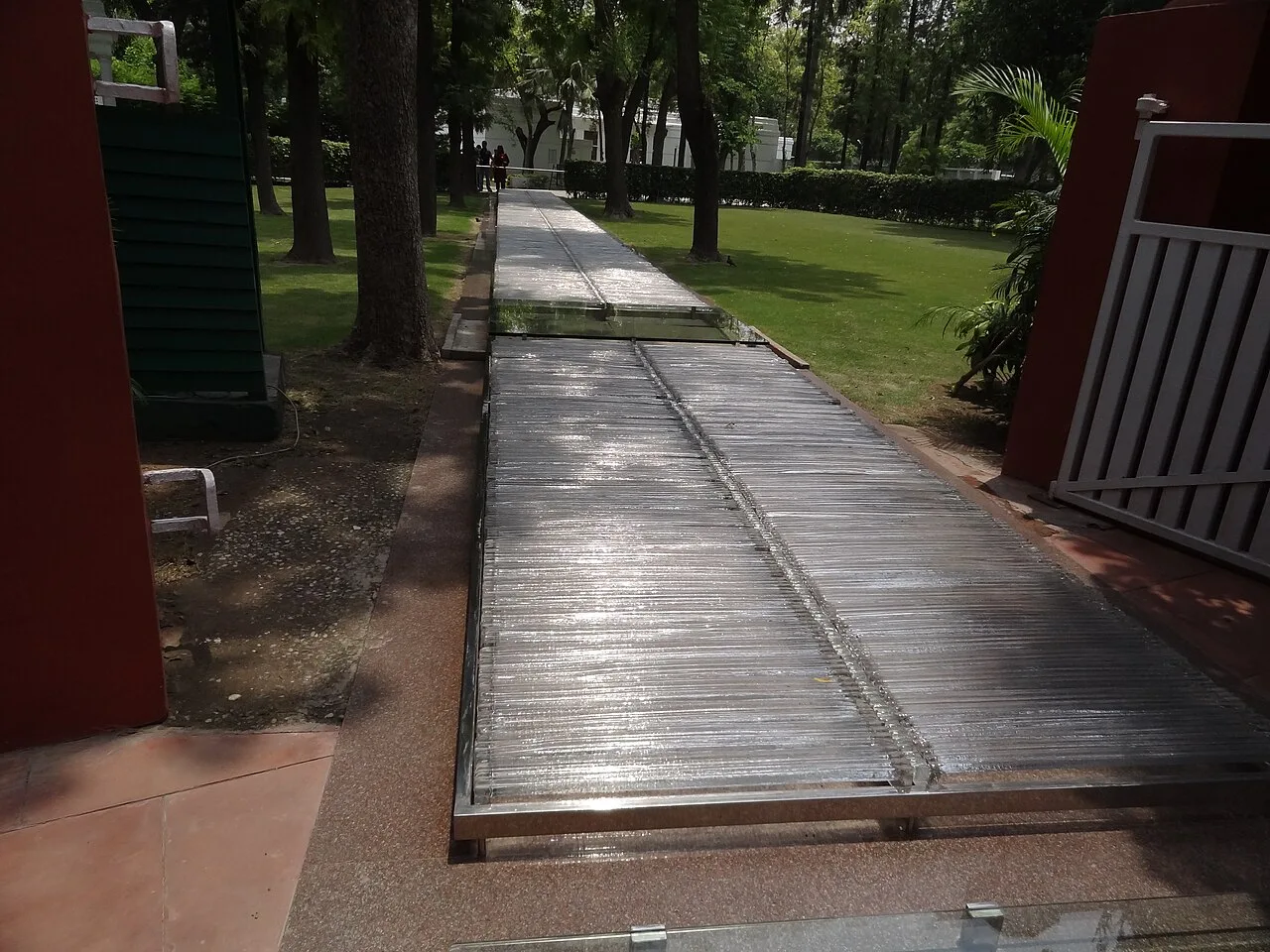 Today, the spot where Gandhi was assassinated is marked by a glass opening in the crystal pathway at the Indira Gandhi M