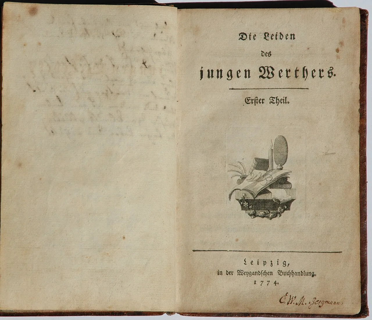 Open book showing the title page of the 1774 first edition of Die Leiden des jungen Werthers, with decorative vignette and publisher information from Leipzig.