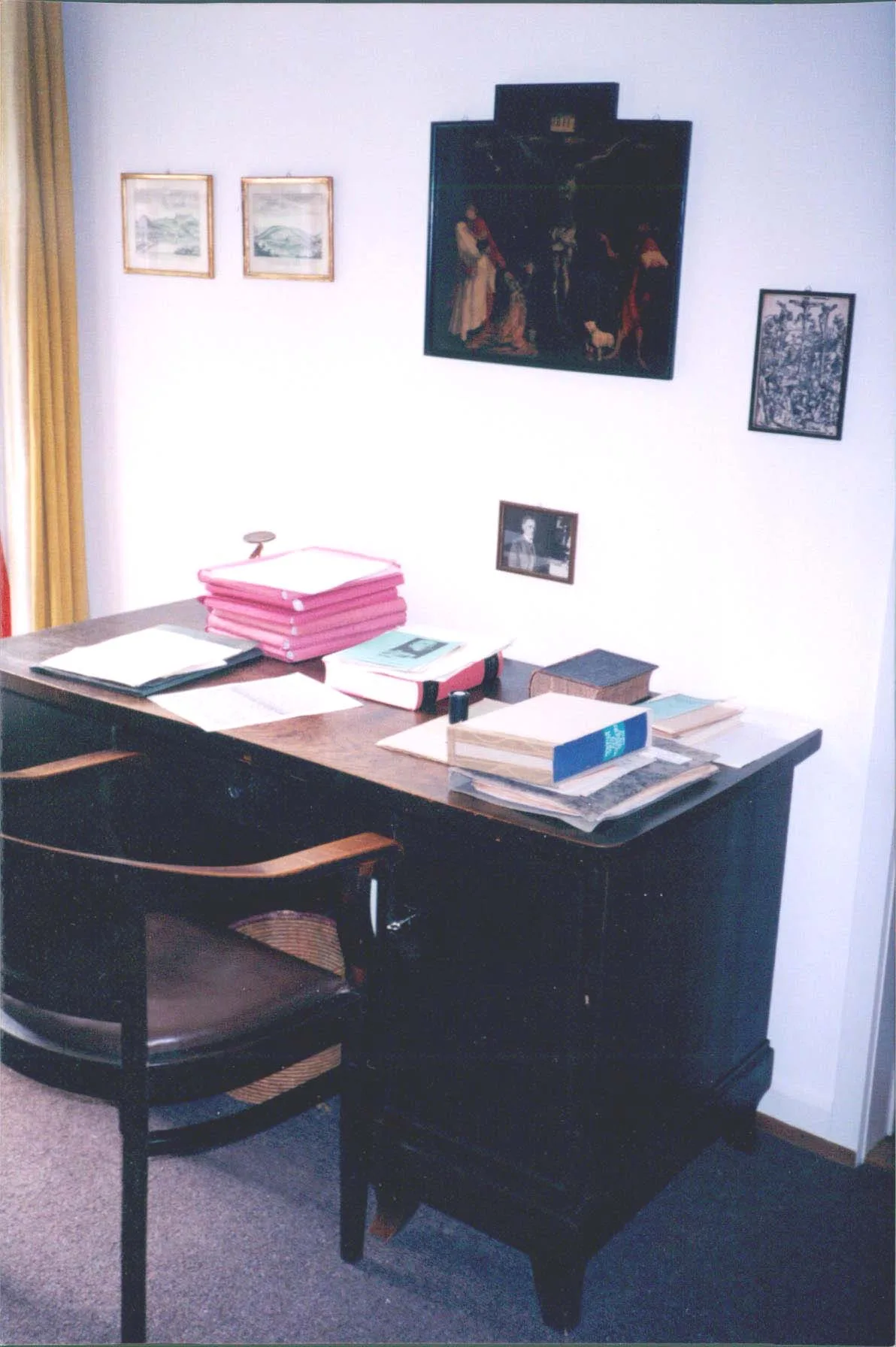 A desk in Karl Barth's old office with a painting of Matthias Grünewald's crucifixion scene
