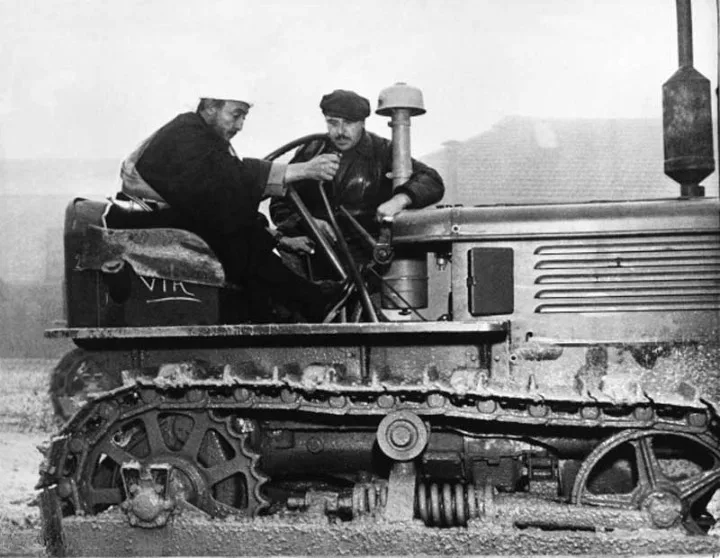 Vizier Hasan bin Yahya driving a tractor in Italy in 1953.