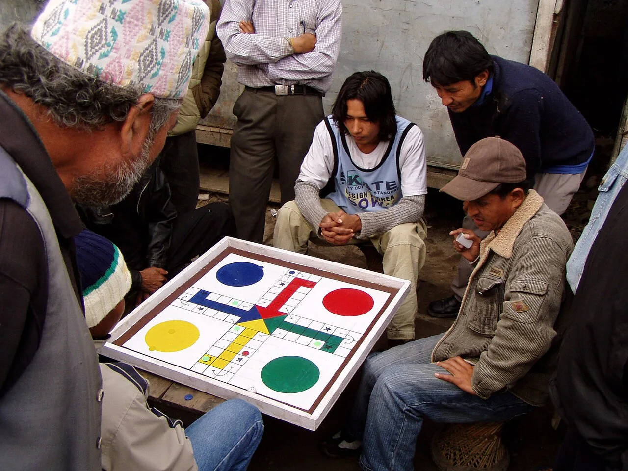 Pachisi variant being played on a Ludo board in Nepal