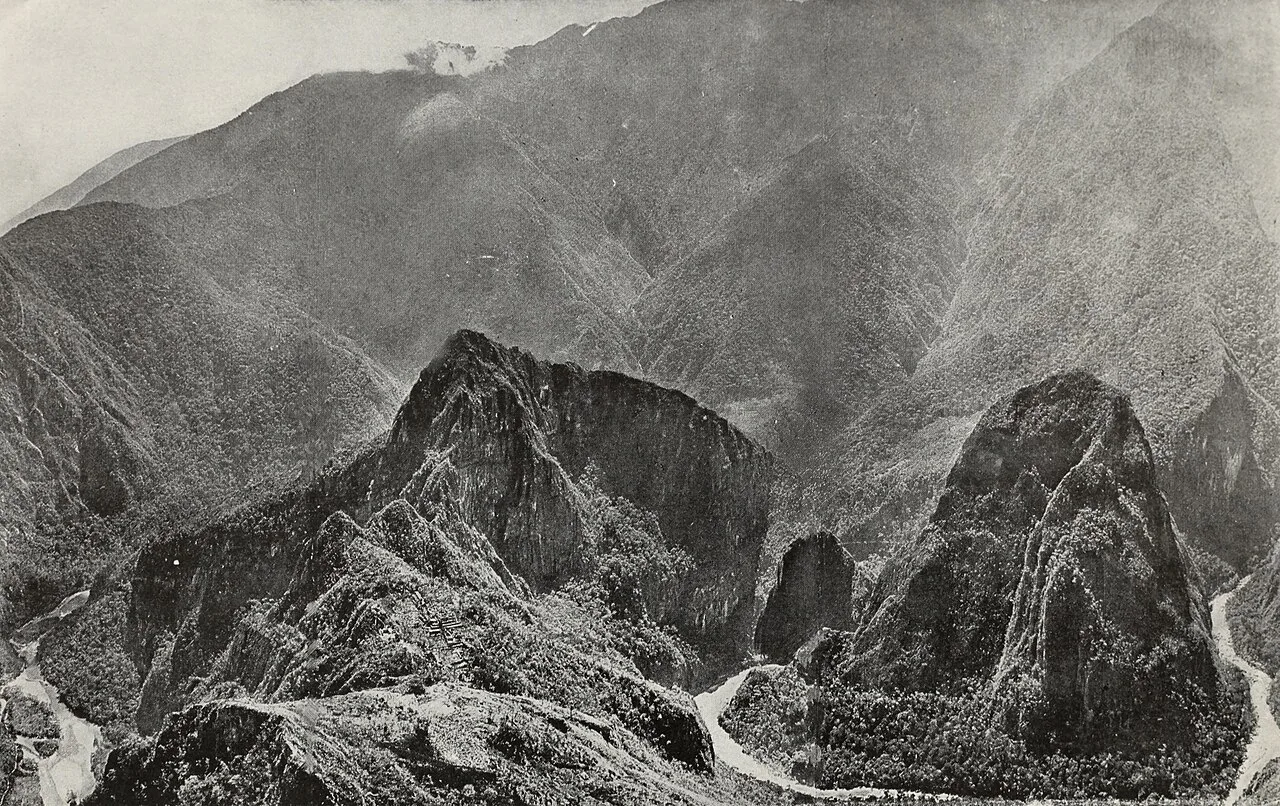 Urubamba River canyon with Machu Picchu, Huayna Picchu and surrounding Andean peaks.