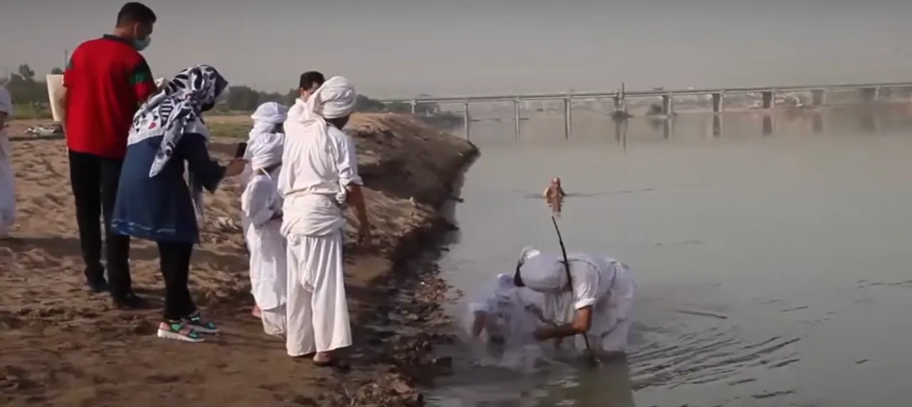 A Mandaean child being baptised (masbuta) in the Karun River, Iran (May 19, 2021)