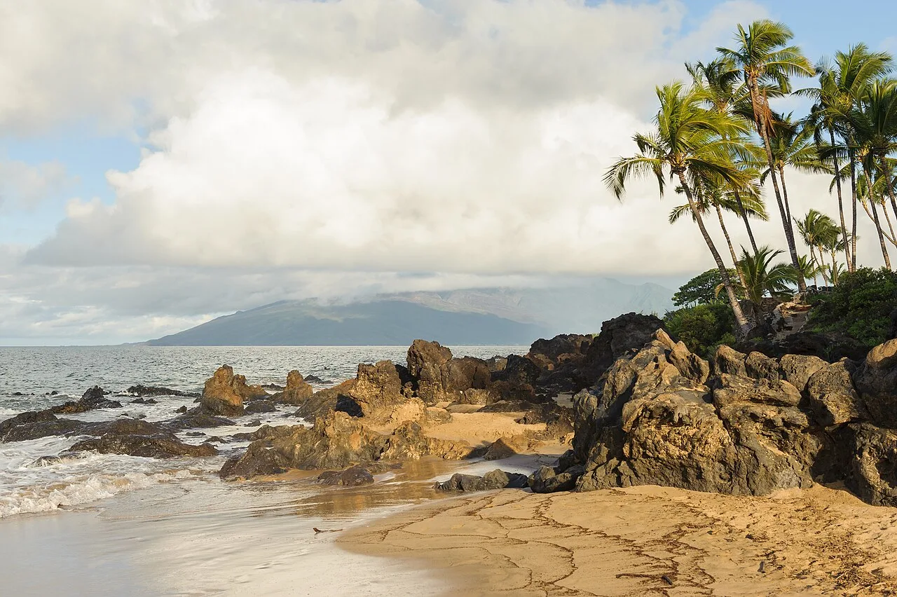 Volcanic rocks protrude on a Maui beach
