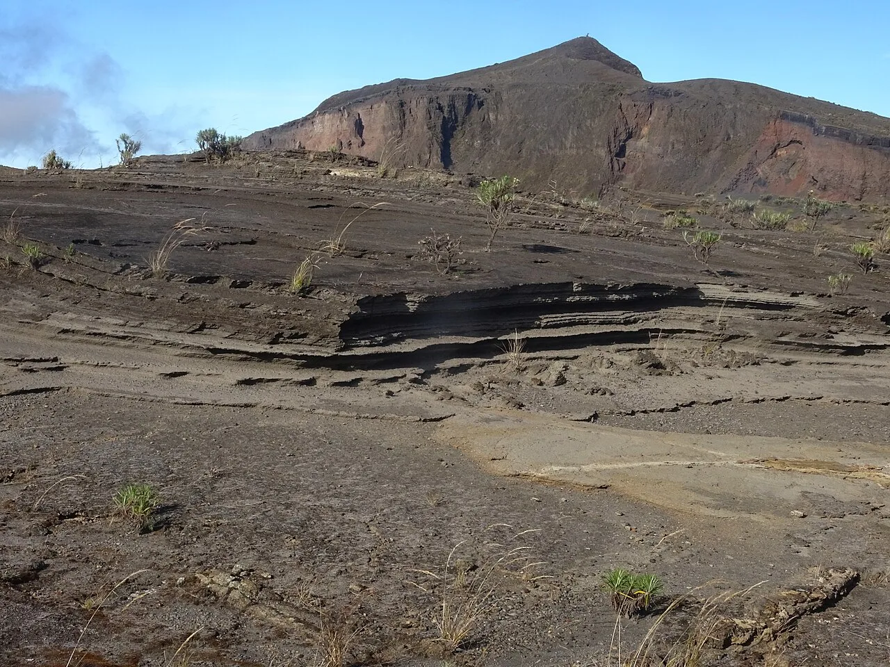 Tephra layers near the caldera (left) and summit (background) of Mount Tambora