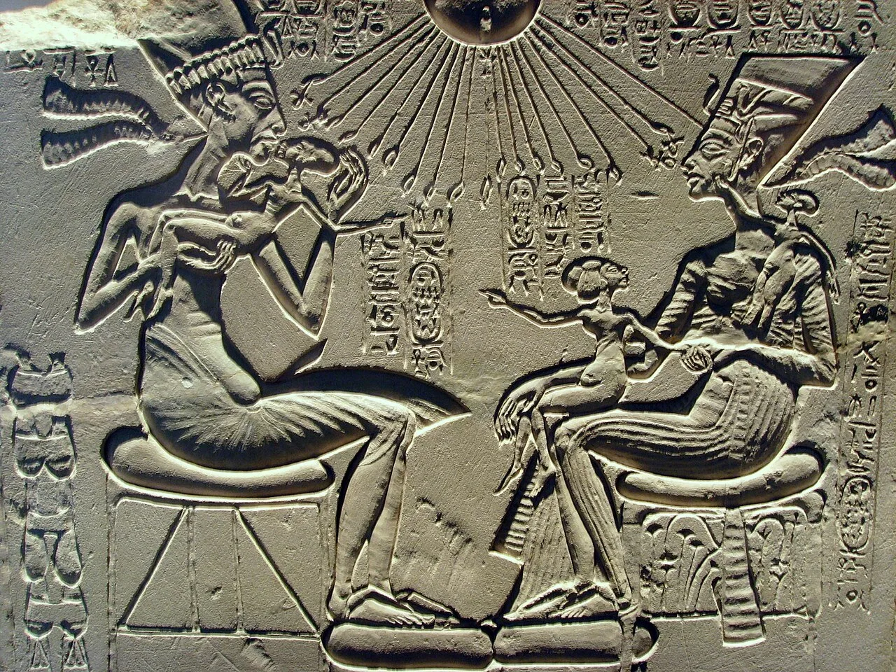 A "house altar" (c. 1350 BC) depicting Akhenaten, Nefertiti and three of their daughters. Nefertiti is shown wearing a c