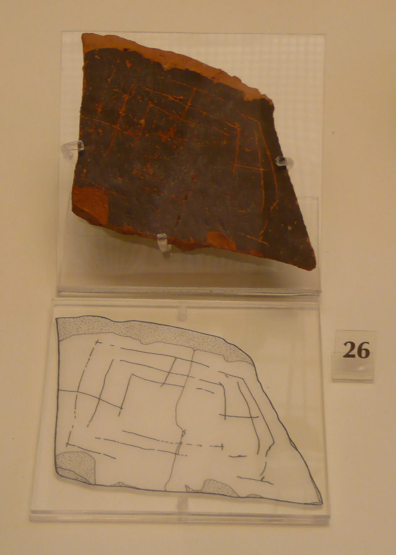 Clay tile fragment from the archeological museum at Mycenae showing what appears to be a Nine Men's Morris board