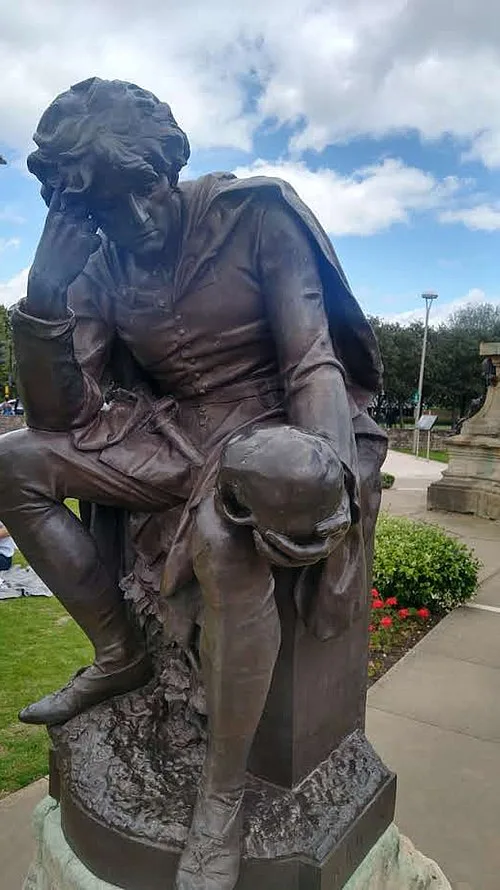 Photo showing a statute of Hamlet holding a skull, from the famous 'Alas poor Yorick' scene.