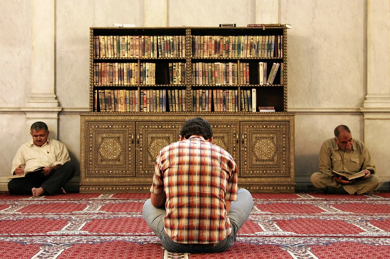 Men reading the Quran at the Umayyad Mosque, Damascus, Syria