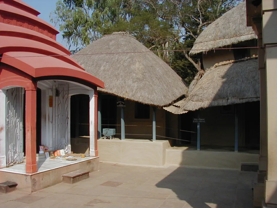 The small house (centre) at Kamarpukur, where Ramakrishna lived. His family shrine (left), with birthplace temple on the