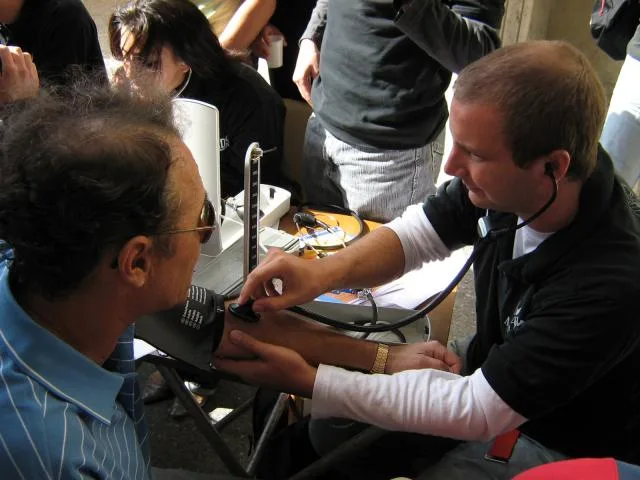 Medical student taking blood pressure at the brachial artery