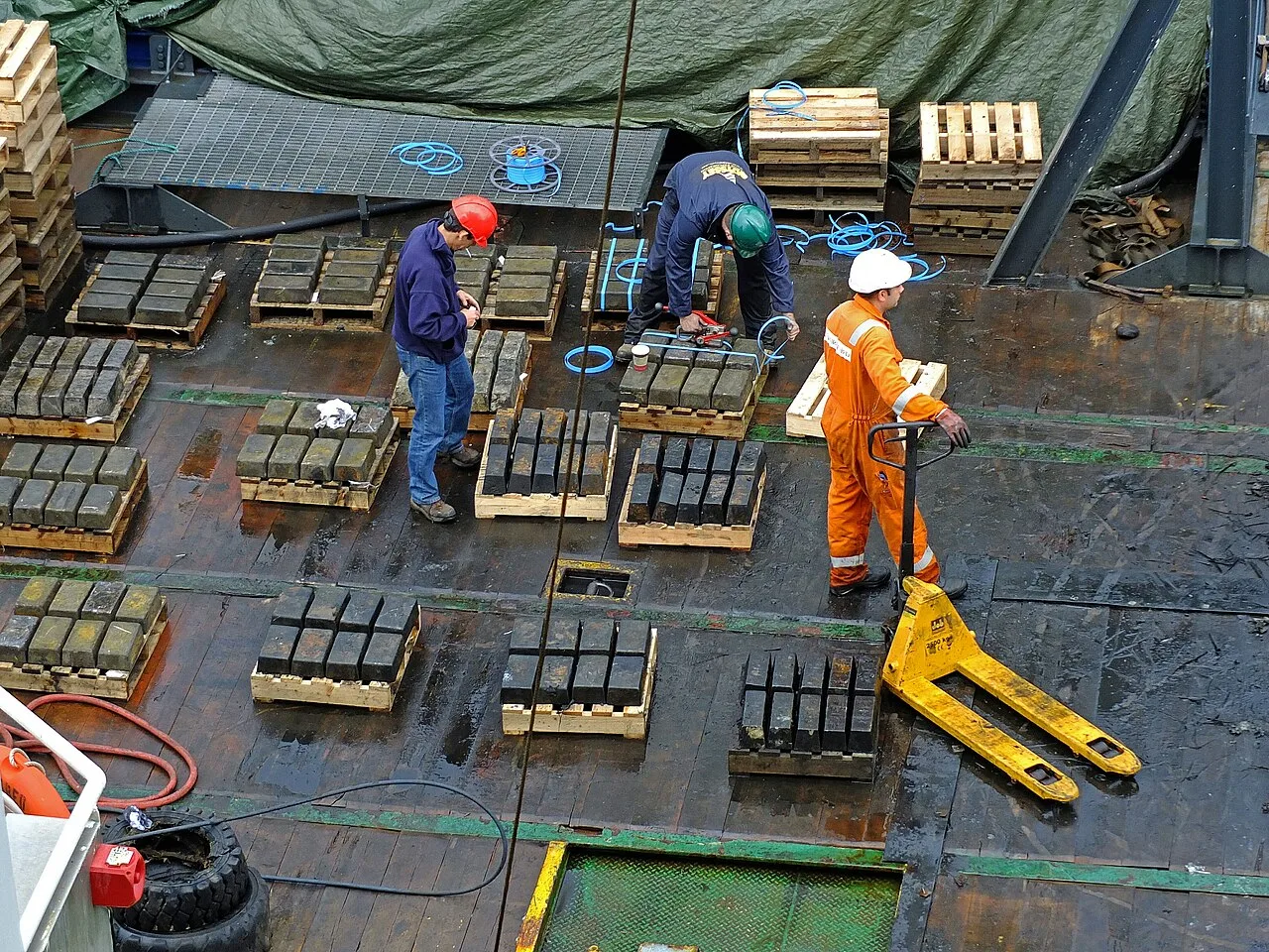 Salvors inspecting some of the silver recovered from Gairsoppa in 2013