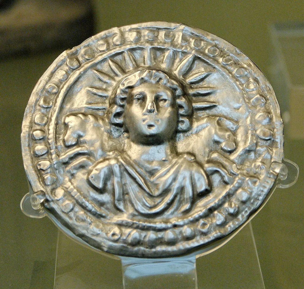 Leaf disc dedicated to Sol Invictus, sun god of the late Roman Empire. Sol Invictus, along with Libertas the Roman godde