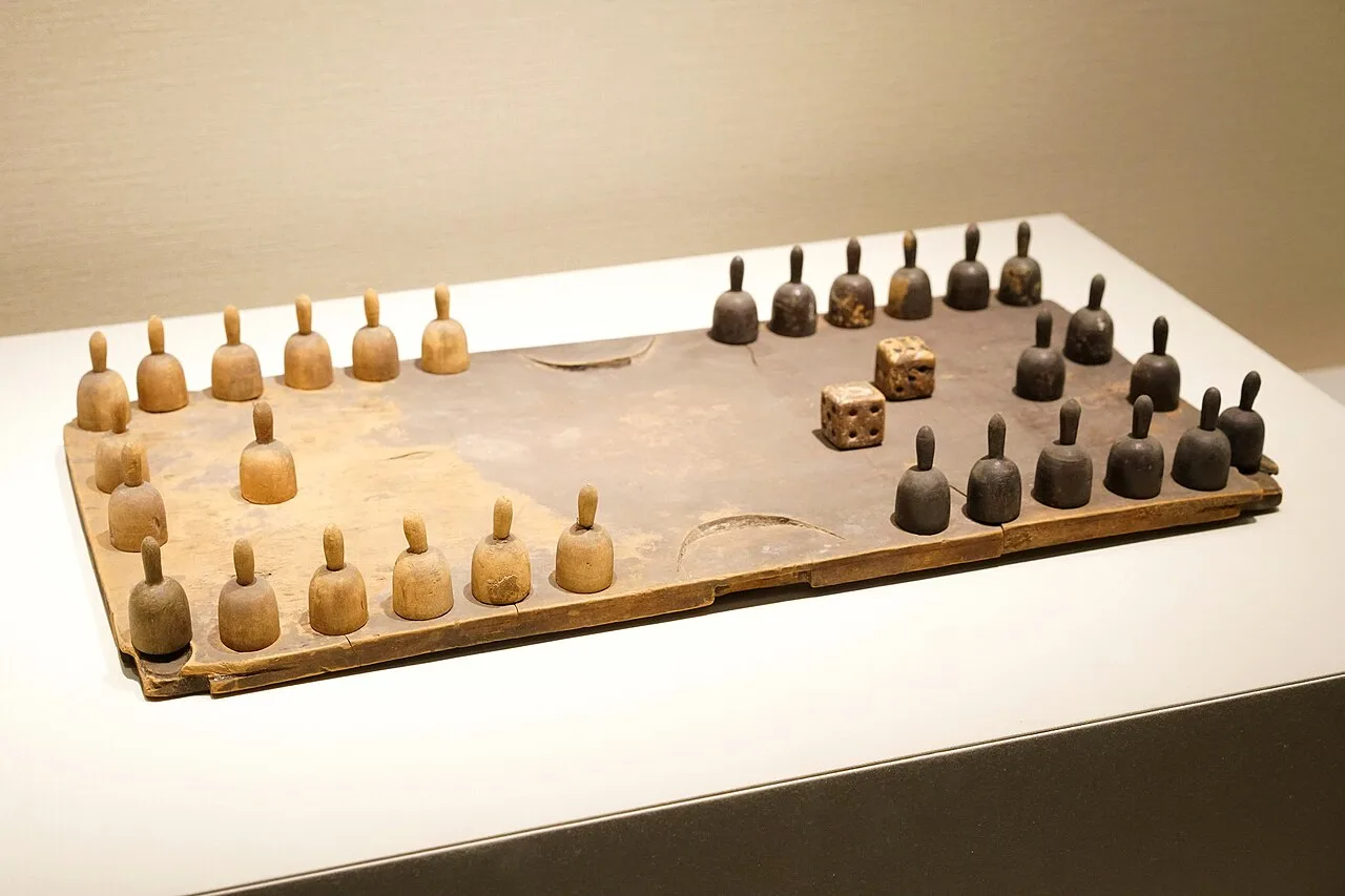 A board and pieces for playing "double six", Liao dynasty