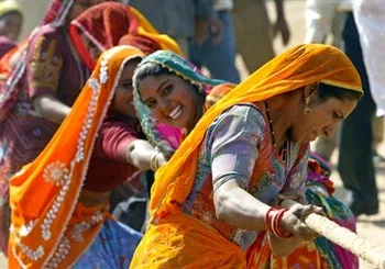 Women in a tug of war, at the annual Pushkar Fair, Rajasthan, India