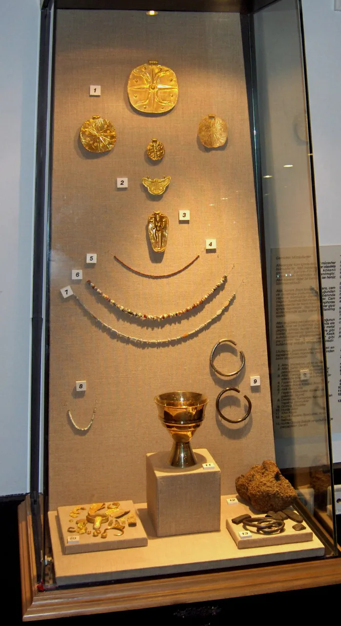 Egyptian jewelry 1 gold disk-shaped pendant 2. gold falcon pendant 3. gold goddess pendant 4. faience beads 5. rock cry