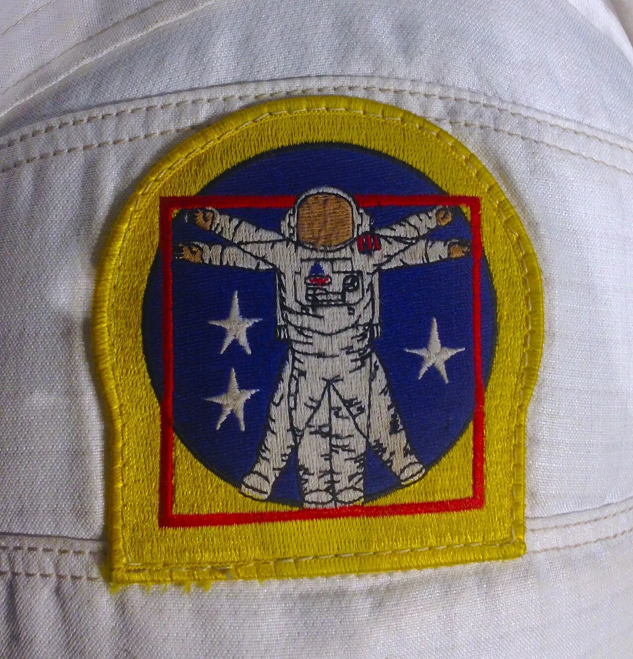 (left) Patch of the Skylab 3 mission (erroneously written as 2), showing the Vitruvian Man in the center; (right) NASA's
